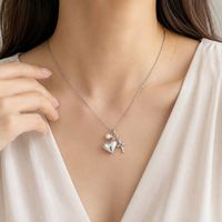Collier avec pendentif en forme de cœur en acier inoxydable personnalisé avec breloque en perle pour commande OEM ODM de marque