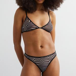 Culotte string sexy en nylon sans couture, taille basse, respirante, avec dentelle ajourée, forme unie, pour femme, vente en gros - Product Image 4