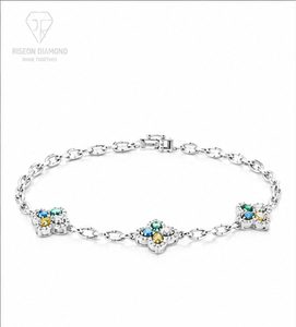 Elegante pulsera tipo station en oro blanco de 18 quilates con motivos florales y diamantes cultivados en laboratorio de colores vibrantes en tonos azul, amarillo y verde. - Product Image 1