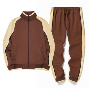 <b>zip</b>-<b>up</b> tracksuits. Modern contrast-panel design with sharp <b>white</b> accents and comfortable tapered joggers. - Product Image 1