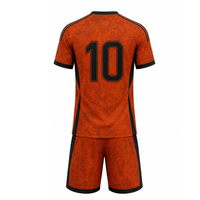 Uniforme de fútbol moderno sublimado con textura naranja y negra, conjunto de uniforme de fútbol para entrenamiento deportivo