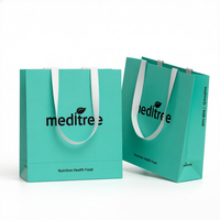 Sac fourre-tout en papier écologique de luxe haut de gamme avec des sangles blanches contrastées de qualité médicale pour les cadeaux d'entreprise et l'utilisation en supermarché