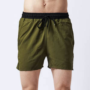 กางเกงขาสั้นผ้าแคนวาสแบบผูกเชือกสำหรับผู้ชายกางเกงขาสั้นผ้าฝ้าย100% แบบหลวมลายกรดซักในฤดูร้อนออกแบบได้ตามต้องการ - Product Image 1