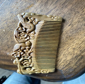 Hand-<b>carved</b> <b>wooden</b> comb featuring traditional swirling cloud scroll patterns along top, available at wholesale prices. - Product Image 6
