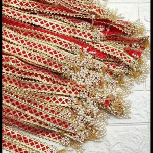 Ensemble de latkans de mariage en velours rouge, exquis et fait main, conçu pour ajouter un charme royal aux lehengas, dupattas, potlis et décorations de mariage. - Product Image 2