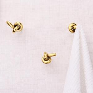 Crochet mural en métal finition or, design nœud, élégant et décoratif, pour suspendre écharpes, casquettes, tabliers et accessoires de mode - Product Image 3