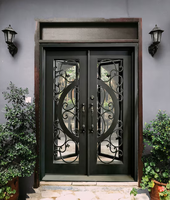 Portes d'entrée en fer forgé et verre, étanches, de luxe, sur mesure, pour extérieur, avec ouverture battante, finition artisanale, modèle 2026