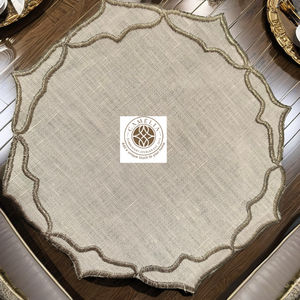 Linen cocktail napkin with flowing golden leaf <b>edges</b>, adding a warm, elegant highlight to table settings. - Product Image 4