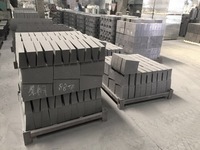 Brique de revêtement réfractaire en graphite pour four rotatif, bloc de carbone noir pour la protection contre l'usure de la zone de combustion des calcineurs à ciment et à chaux