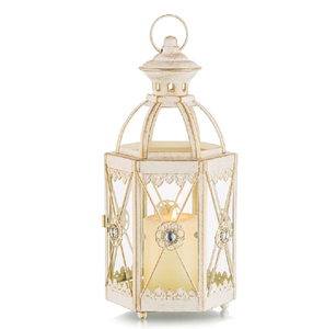 Elegante farol cilíndrico de metal blanco con asa dorada y recortes perforados abstractos, disponible a precios de mayorista. - Product Image 4