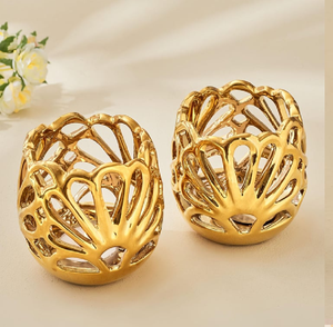 Set of two gold hollow cut-out votive <b>candle</b> <b>holders</b>, available at wholesale prices for decorative tabletop lighting. - Product Image 1