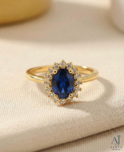 Bague de fiançailles AARVA JEWELS pour femme, plaquée rhodium or jaune, saphir bleu ovale, sertissage à griffes en forme de halo floral, style classique - Product Image 1