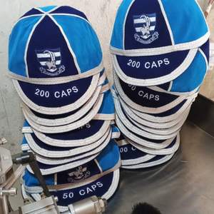 This is a grey and tan mesh adjustable trucker cap - Product Image 3