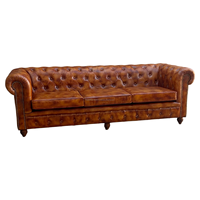 Fauteuil Chesterfield design en cuir, une place, dossier capitonné, accoudoirs roulés, structure en bois massif, pour appartement, hôtel, extérieur