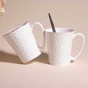 Embossed Pure White Ceramic Tea Cups Set of 2 - Product Image 1
