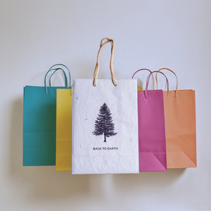 Sustainable <b>Packaging</b> Carry <b>Bag</b> for Retail Use Floral Accent Handmade Paper <b>Bag</b> for Stylish Presentation Gift <b>Packaging</b> <b>Bags</b> - Product Image 1