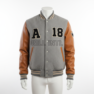 Veste varsity en laine grise pour homme avec manches en cuir marron, logo brodé A18 RILL INTL sur le devant, style preppy, vêtement d'automne - Product Image 1