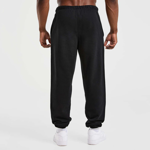 Nouveau pantalon de jogging décontracté pour homme en coton noir, avec logo personnalisé, taille élastique et cordon de serrage, en tissu tricoté, à prix bas - Product Image 2