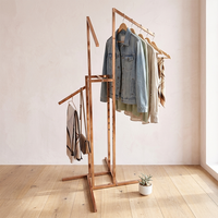 Rak pakaian lipat modern Bros Display, terbuat dari logam kokoh, berdiri sendiri, rak bertingkat, display ritel premium.