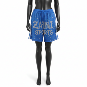 Shorts deportivos transpirables de poliéster para mujer, color azul con paneles laterales blancos, logotipo con pedrería brillante y transferencia térmica. - Product Image 1