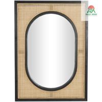 Miroir mural marron avec cadres noirs. Les miroirs, le rotin, le bois de pin et le bois MDF créent un look naturel et spirituel.