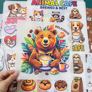 พร้อมกดติดฉลากการ์ตูนแบบกำหนดเองที่เป็นมิตรกับสิ่งแวดล้อมสำหรับงานพิมพ์ลายร้อนแบบลอกออกได้สำหรับงานฝีมือและเสื้อผ้า - Product Image 1