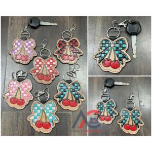 พวงกุญแจหนังวัวแท้ลายตารางหมากรุก ดีไซน์โบว์เชอร์รี่ งานแฮนด์เมด ของที่ระลึกสุดฮิตปี 2026 สำหรับทุกเพศ - Product Image 1