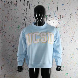 Sudadera UCSD Azul Cielo con Cuello Alto, 100% Blanca, Apliques Bordados, Cuello Ancho, CLUSH SPORTS - Product Image 1