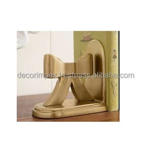 Estos sujetalibros decorativos están diseñados con una elegante forma de lazo y un cálido acabado de latón, lo que agrega un toque de glamour - Product Image 1