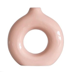 Vase à fleurs rond minimaliste en céramique rose en forme de beignet, finition mate, pour la décoration de la maison - Product Image 1