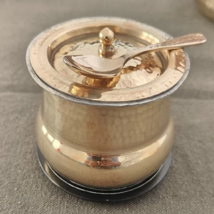 Antique dark finish brass ghee <b>pot</b> with a beautiful floral motif and a golden spoon. Available at wholesale price. - Product Image 3