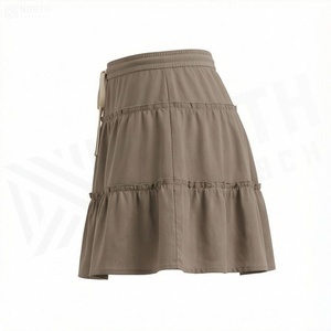 Jupe courte à volants pour femmes, taille élastique, couleur unie, design décontracté en forme de A, tissu polyester confortable, à porter en toutes saisons - Product Image 3