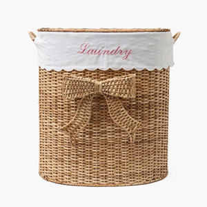 Cesto de lavandería decorativo de mimbre delicado con lazo, organizador de mimbre natural, perfecto para almacenamiento en el baño. - Product Image 1