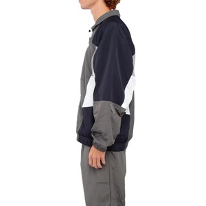 Chaqueta Cortavientos Deportiva Ligera para Hombre, con Bloques de Color, Cuello Camisero, Manga Larga y Detalles Reflectantes - Product Image 1