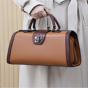 Classic tan satchel with a vintage-inspired silver latch and contrast <b>stitching</b>. Timeless. Available at wholesale prices. - Product Image 5