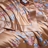 Parure de lit de luxe en soie de mûrier or rose, quatre pièces, avec housse de couette imprimée, drap et taies d'oreiller en fil teint naturel
