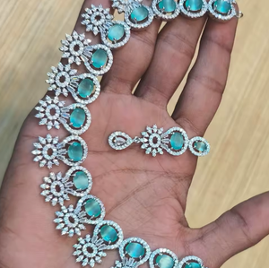 Beautiful white and sea green emerald crafted <b>statement</b> <b>necklace</b> and earrings set for party wear and wedding wear - Product Image 1