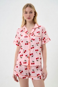 Womens blue star print pajama set with short sleeve button up top and drawstring pants in studio for cute comfortable sleepwear - Product Image 4