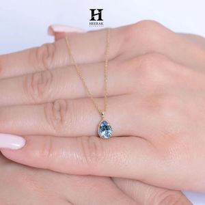 Elegante colgante de piedra azul con corte de pera en oro macizo – Joyería fina - Product Image 5