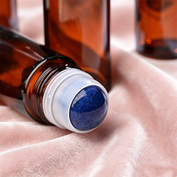 Flacon roll-on en verre épais rechargeable de 30 ml/50 ml avec bouchon à vis, rouleau en pierre, estampage à chaud doré et sérigraphie pour huiles essentielles et soins de la peau