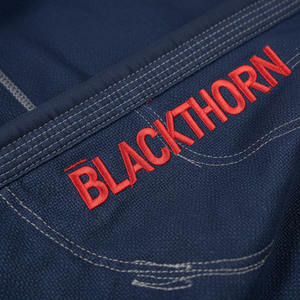 เสื้อผ้าฝึกซ้อม BJJ คุณภาพสูง น้ำหนักเบา 350 GSM ผ้าฝ้ายยืด 100% สำหรับทุกเพศ ไม่หดตัว ทนทาน แห้งเร็ว ระบายอากาศได้ดี รับสกรีนโลโก้ - Product Image 4