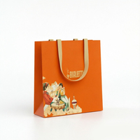 Emballage cadeau de luxe en papier blanc et orange avec accents dorés coordonnés pour le branding de marques haut de gamme de thé et de café, idéal pour les supermarchés