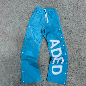 กางเกงแทร็คแพนท์ผ้าไนลอนปักลายโลโก้คุณภาพสูงแบบสั่งทำพิเศษสำหรับผู้ชาย สไตล์สตรีทแวร์ กระดุมแป๊ก ทรงจ็อกเกอร์ ขากว้าง - Product Image 4