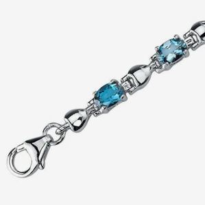 Pulsera de tenis elegante y minimalista de plata de ley chapada en oro con topacio azul de Londres, corte ovalado, 5.5 quilates, certificada, para aniversario - Product Image 4