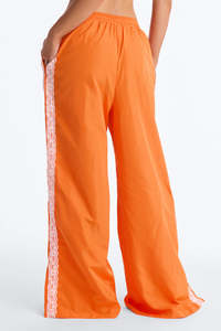 Pantalon de survêtement graphique orange personnalisé pour femme, coupe large avec lacets latéraux, décontracté, avec cordon de serrage, fabrication OEM, pantalon pour homme - Product Image 4