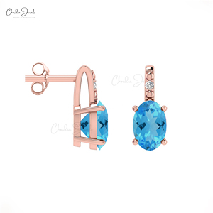Pendientes de tuerca ovalados de topacio azul suizo de 6x4 mm con detalles de diamantes y cierre a presión de oro macizo de 14k, joyería al por mayor para bodas - Product Image 3