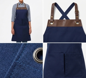 Delantal unisex de algodón azul marino con correas de cuero marrón y bolsillos frontales para uso en restaurantes, bares y cocinas. - Product Image 4