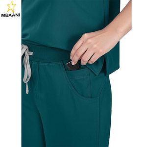 ชุดยูนิฟอร์มแพทย์สำหรับผู้หญิง - เสื้อโปโลแบบครอปติดซิปด้านหน้าและกางเกงขายาวทรงตรงพร้อมกระเป๋า 8 ช่อง ดูแลรักษาง่าย - Product Image 6