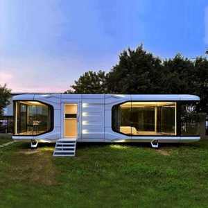Maison capsule préfabriquée moderne, petite et modulaire, pour jardin, avec structure en aluminium thermolaqué et verre transparent, chambre et salon. - Product Image 5