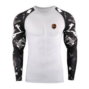 Camisetas de compresión para gimnasio para hombre con tela flexible, estructura que se adapta al cuerpo y costuras duraderas para entrenamientos intensos - Product Image 1